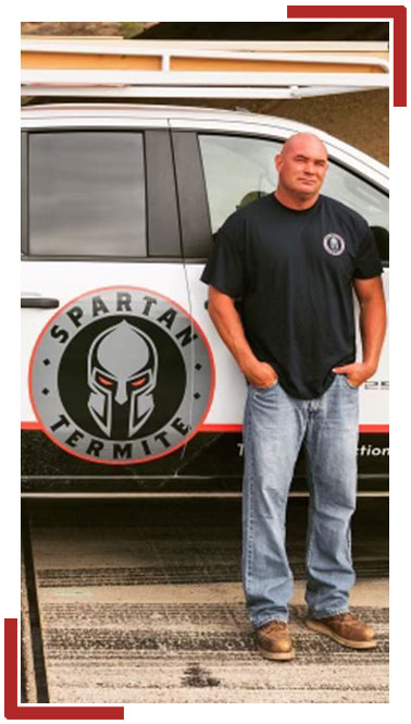 Members of the Spartan Termite team standing in front of work truck